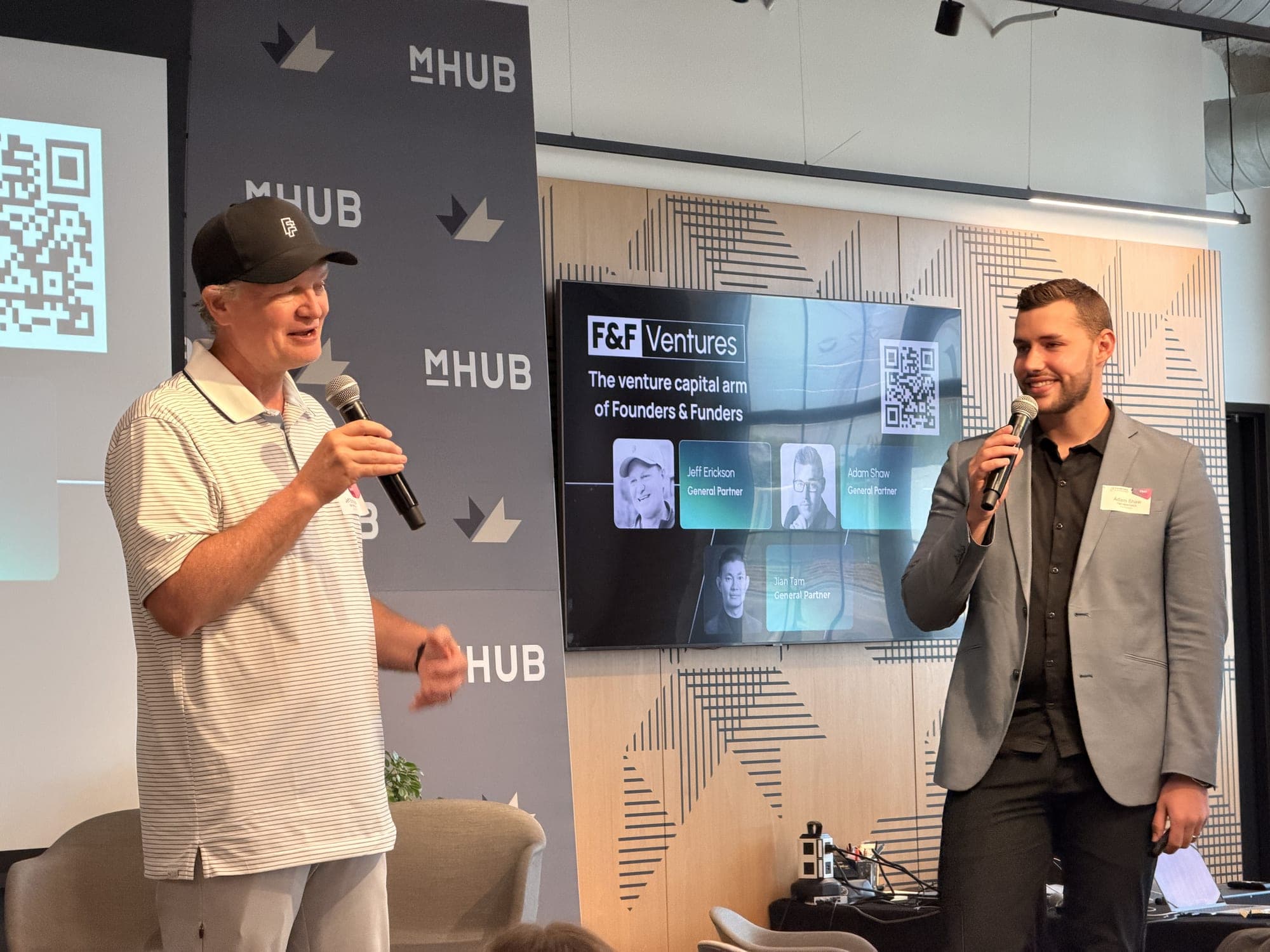 Speakers on the mic at a Founders & Funders event
